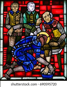 WORMS, GERMANY - JULY 4, 2017: Stained Glass in Worms, Germany, depicting Jesus washing the feet of the Apostle Peter at the Last Supper on Maundy Thursday
