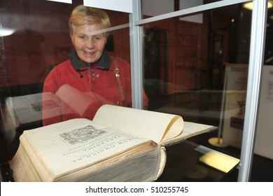 Worms, Germany - October 27, 2010 - Old People At Martin Luther Exhibition In Worms With Old Bible