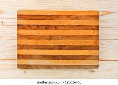 Worn Butcher Block Cutting And Chopping Wooden Plate Board As Background. Wood Texture, Top View