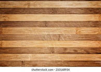 Worn butcher block cutting plate and chopping wooden board as background. Wood texture.