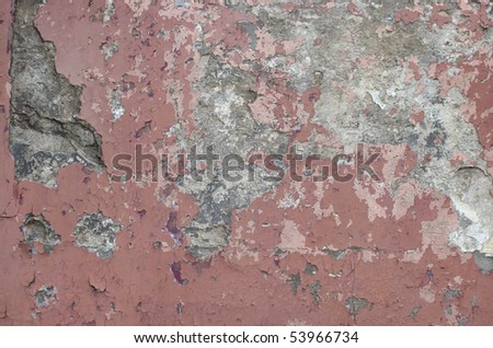 worn gray red painted wall with paint chip crack and blathering