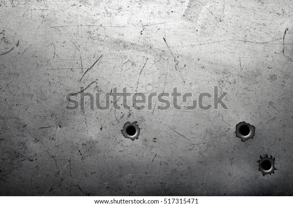 Worn metal background\
with bullet holes