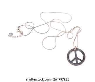 Worn Metal Peace Sign Necklace Isolated Over The White Background