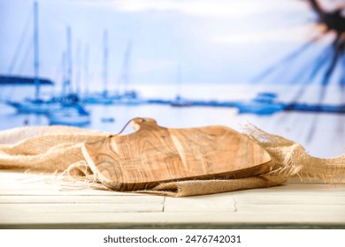 Worn old brown table of empty space for your decoration and summer landscape of sea with sunset time. 