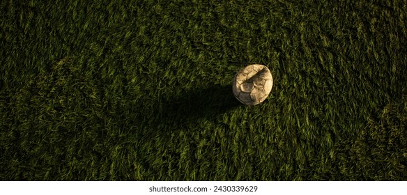 Worn old football on artificial grass. Lit by sunlight. - Powered by Shutterstock