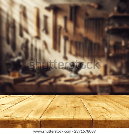 Worn old wooden table and workshop interior. Retro vintage photo of background and mockup. Sun light and dark shadows. 