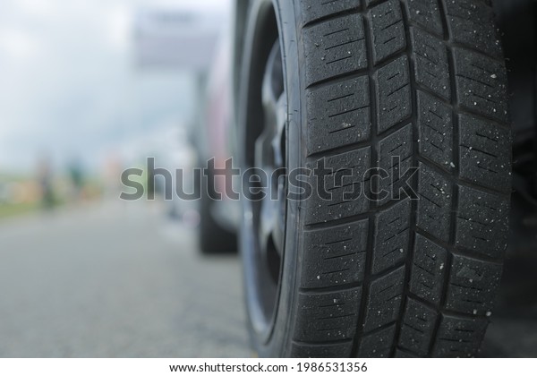 worn out tire on\
the asphalt on a sunny day\
