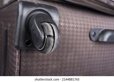 Worn Out Wheel On A Rolling Luggage Trunk