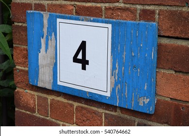 Worn Out Wooden Door Number Sign