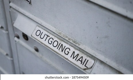 Worn Outgoing Mail Sign On A Cluster Mailbox