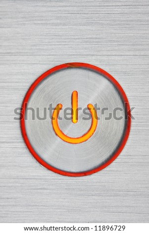 the worn powerbutton of a used notebook