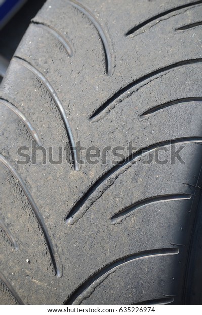 Worn racing intermediate\
wet tire.