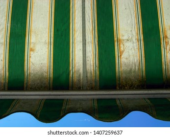 Worn Retractable Awnings Photographed From Below