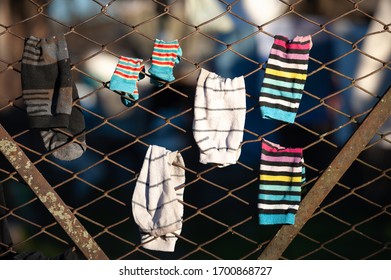 Worn Socks Drying Showing A Very Humble Family. Buenos Aires, Argentina