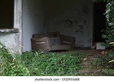 Worn Sofa In An Abandoned House