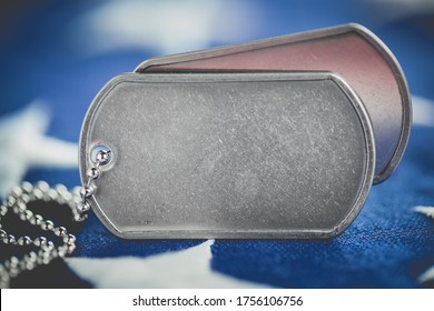 Worn USA military dog tags close up on US American flag with blank space for text - Powered by Shutterstock