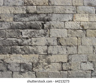 Worn Very Old Large Stone Wall In Gray And Beige