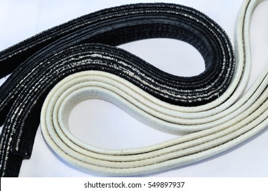 Worn White And Black Belt In Martial Arts. Belts Are Complex In The Form Of Yin Yang