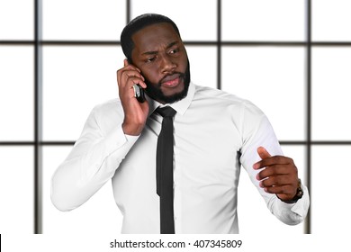 Worried Afro Guy With Cellphone. Chief's Phonecall On White Background. Don't Lose Your Hope. Big Serious Problems.