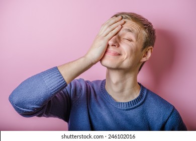 Worried Or Ashamed Man Covering His Face With Hand 