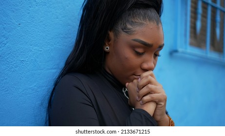 A Worried Black Girl Praying To God A Pensive Preoccupied Teenager