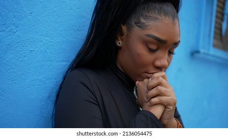 A Worried Black Girl Praying To God A Pensive Preoccupied Teenager