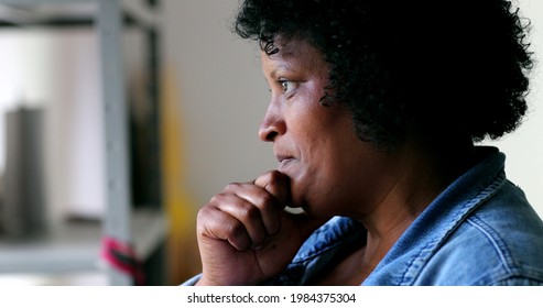 Worried Black Woman Feeling Anxiety Rubbing Face With Hand