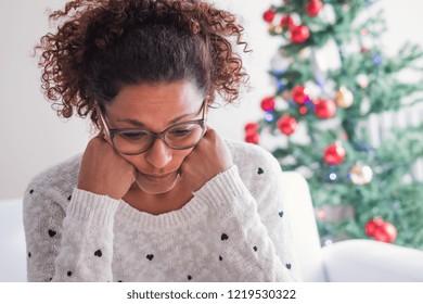 Worried Black Young Woman Sitting In The Living Room At Home During Christmas Holiday
