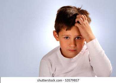 Worried Boy Scratching His Head