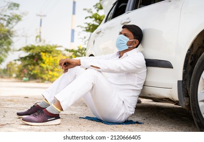 Worried Cab Driver With Medical Face Mask Thinking By Sitting In Front Of Car - Concept Of Job Loss, Thoughtful, Covid-19 Lockdown And Financial Problem.