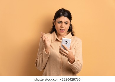 worried caucasian woman with sad face expression in studio shot. communication, app, connection concept. - Shutterstock ID 2326428765