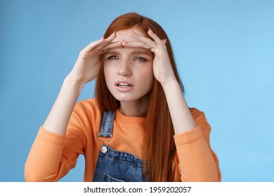 Worried Clingy Redhead Girlfriend Spying Boyfriend Peer From Distance Squinting Focus Sight Look Afar Hold Hands Forehead Cover Eyes Sunlight Standing Concentrated Blue Background.