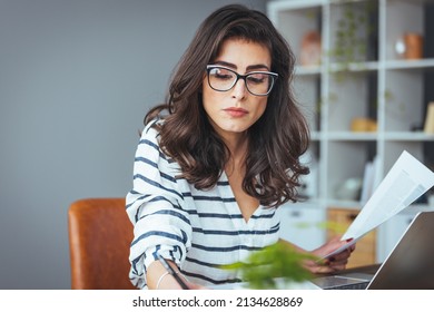 Worried And Desperate Woman Banking And Accounting Home Monthly And Credit Card Expenses With Computer Laptop Doing Paperwork In Living Cost Stress And Paying Bills Problem.