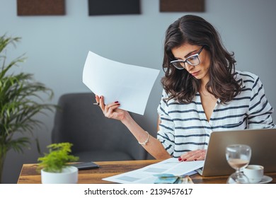 Worried And Desperate Woman Banking And Accounting Home Monthly And Credit Card Expenses With Computer Laptop Doing Paperwork In Living Cost Stress And Paying Bills Problem.