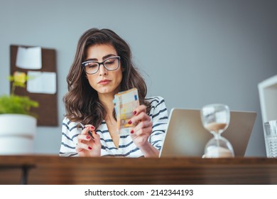 Worried And Desperate Woman Banking And Accounting Home Monthly And Credit Card Expenses With Computer Laptop Doing Paperwork In Living Cost Stress And Paying Bills Problem.