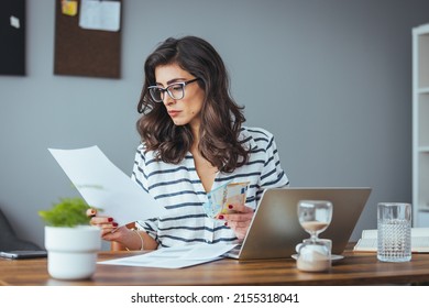 Worried And Desperate Woman Banking And Accounting Home Monthly And Credit Card Expenses With Computer Laptop Doing Paperwork In Living Cost Stress And Paying Bills Problem.