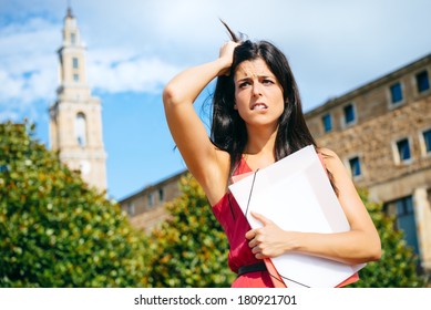 Worried Female Student In Problems. Stressed Young Woman At University Campus After Educational Fail.