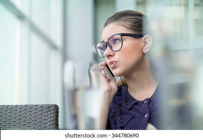 Worried Girl On Mobile Phone. Annoyed Young Woman  Talking About His Problems On Telephone, Something Is Wrong.