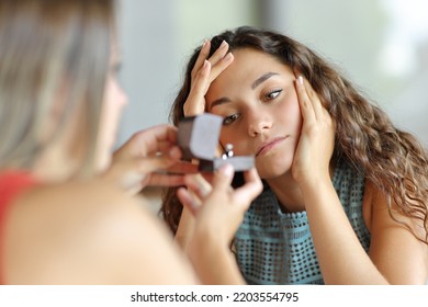 Worried Lesbian Woman In A Marriage Proposal Rejecting Engagement