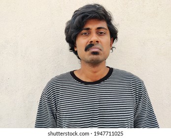 Worried Looking South Indian Man With Half Shaved Moustache. White Background