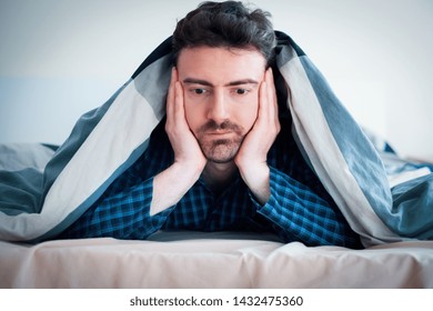 Worried Man Can't Sleep Thinking About Problems