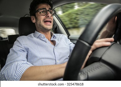 Worried Man Travelling By Car