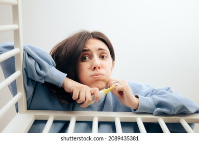 
Worried Mom Holding A Thermometer Caring For Sick Baby. Concerned Mother Worrying For Her Little Newborn
