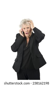 Worried Old Woman Talking On Her Mobile Phone Against A White Background