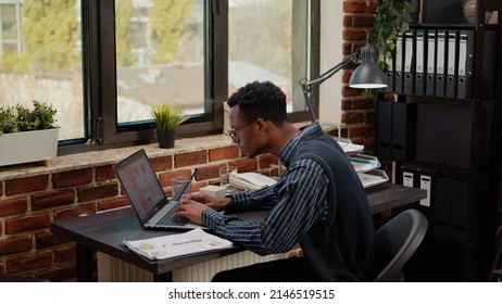 Worried Person Doing Financial Paperwork Under Pressure, Feeling Stressed And Desperate. African American Man Failing To Work On Business Plan Before Deadline, Feeling Depressed About Failure