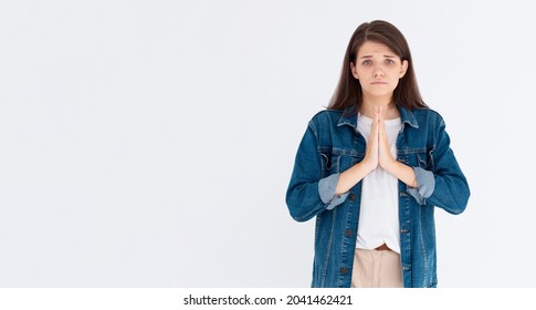 Worried Woman Need Something, Begging For Help And Say Please. Girl Apologizing, Making Clingy Sad Face And Pleading You, Standing Against White Background