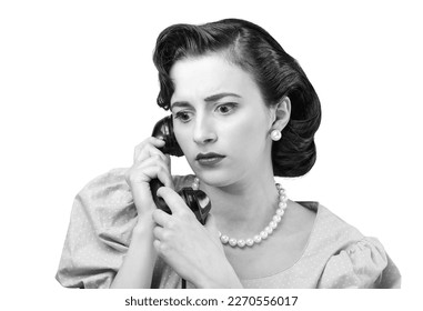 Worried woman on the phone, she is receiving bad news, vintage style - Shutterstock ID 2270556017