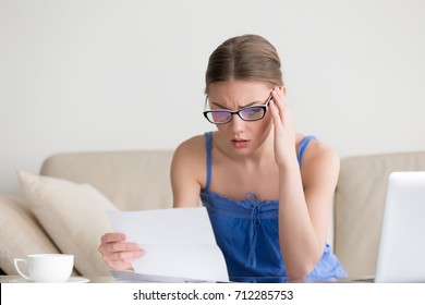 Worried woman reading negative news in letter, student upset by failed test notification, anxious young lady stressed receiving mail with bad medical test results, frustrated by huge domestic bills