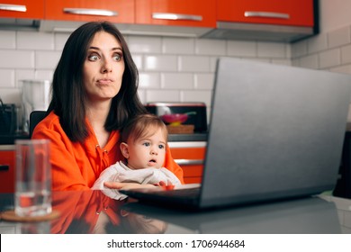 Worried Woman Working A Laptop Holding Her Baby. Busy Multitasking Mom Trying To Complete Task Working From Home
