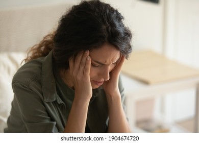 Worried young Caucasian woman feel stressed upset thinking of life problems solution at home. Anxious unhappy millennial female distressed with bad negative news, have relations personal troubles. - Shutterstock ID 1904674720